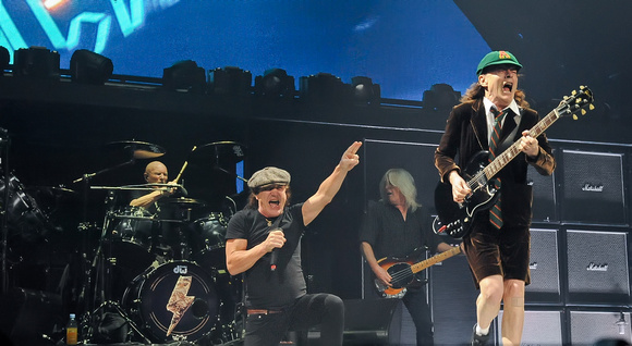 Brian Johnson and Angus Young (R)